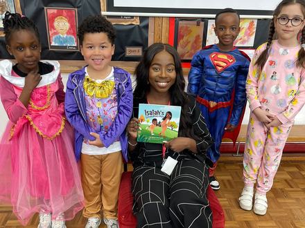 Schoolchildren with a Little Omo book on World Book Day